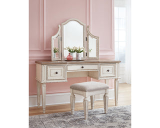 Realyn Queen Upholstery Panel Bed, Dresser, Chest, Nightstand, and Vanity Set
