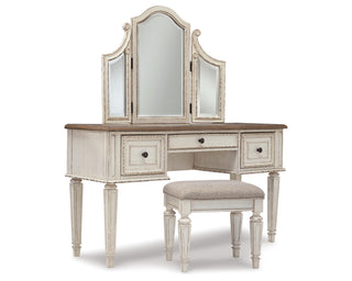 Realyn Queen Upholstery Panel Bed, Dresser, Chest, Nightstand, and Vanity Set